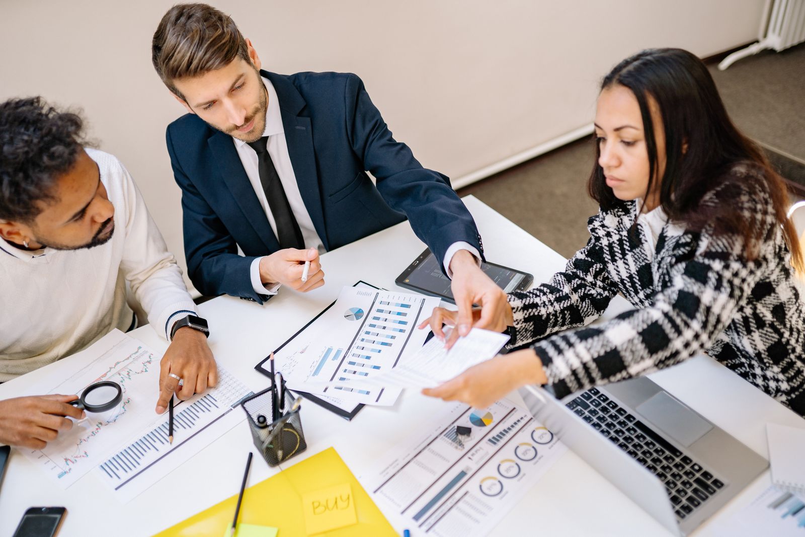 Multicultural business professionals reviewing documents in an office